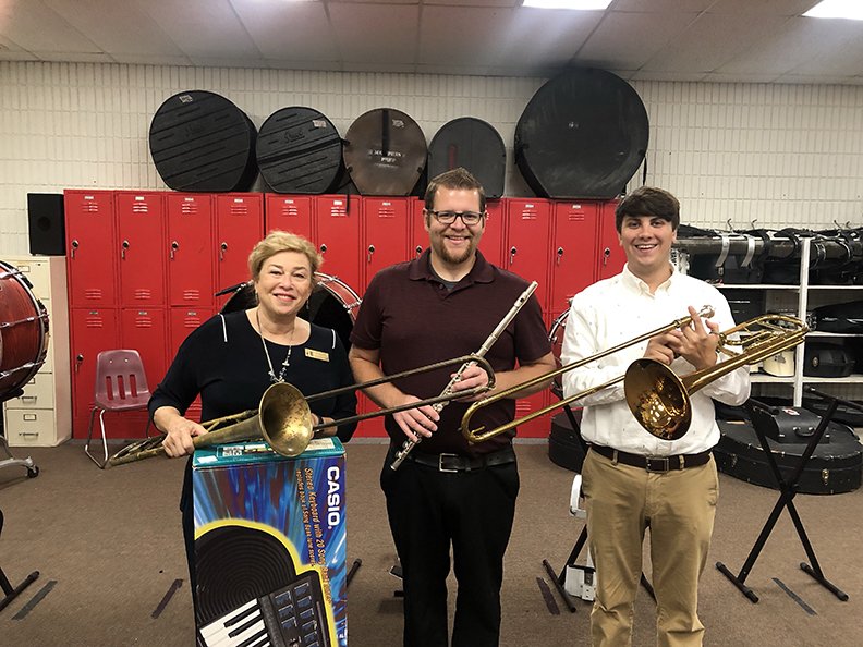 Recently, Hot Springs-Hot Springs Symphony Guild Board Vice President Donna Toney, left, presented Mountain Pine Schools band director Christopher Johns, center, and assistant music director Jake Nottingham, right, with a keyboard and a flute donated by Villagers, as well as her father and son's trombones. To donate an instrument, call Toney at 225-247-8340. - Submitted photo