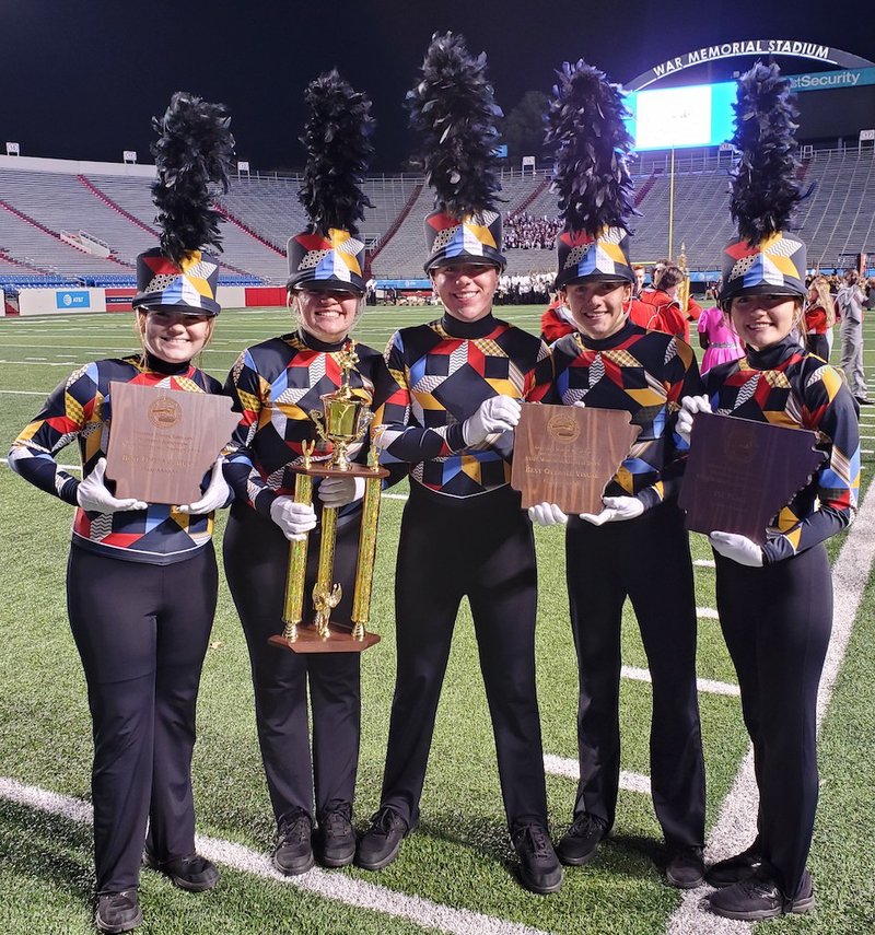 Lake Hamilton High School Power Band drum majors, from left, Abby Dampier, Tess Butler, Jeremy Peret, Elijah Pavatt and Emma Hibbs hold the band's state championship trophies at the Arkansas Activities Association State Championship at War Memorial Stadium in Little Rock on Tuesday. - Submitted photo