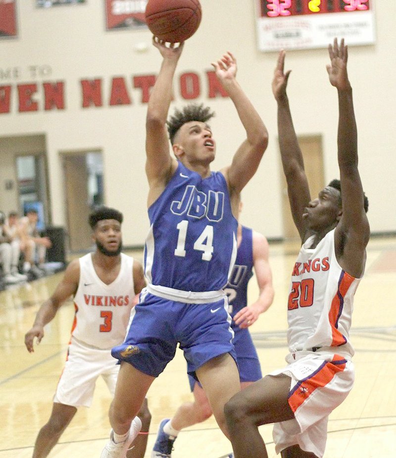 Photo courtesy of Benedictine College John Brown freshman James Beckom goes up for a shot Friday against Missouri Valley College at the Benedictine (Kan.) Classic.