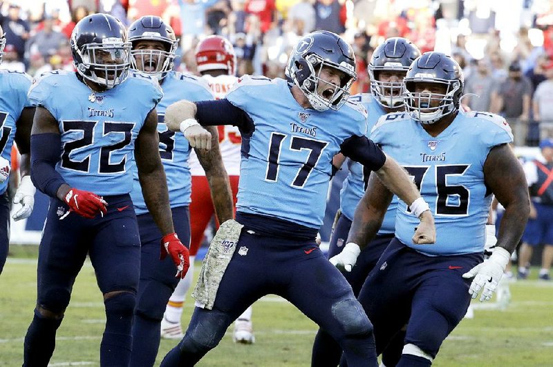 Tennessee Titans quarterback Ryan Tannehill (center) celebrates after scoring on a two-point conversion following Adam Humphries’ go-ahead touchdown with 23 seconds left in Sunday’s 35-32 victory over the Kansas City Chiefs in Nashville, Tenn.