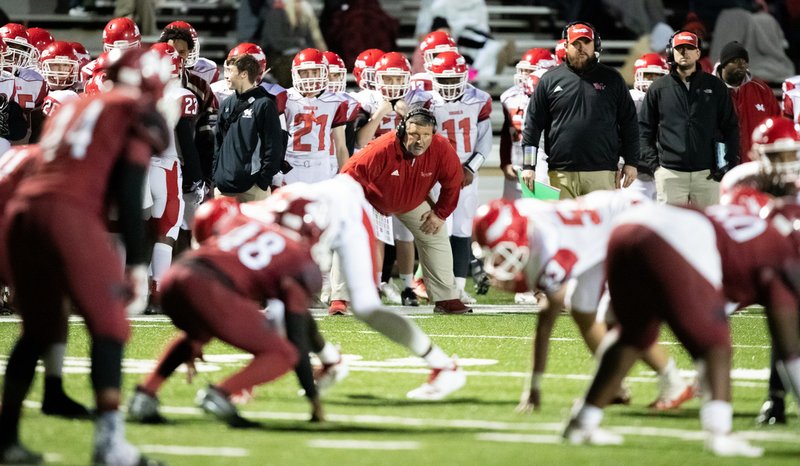 Magnolia Head Coach Mark King (middle) in first season at the team's helm has the Panthers headed back to the state football playoffs. story.lead_photo.caption