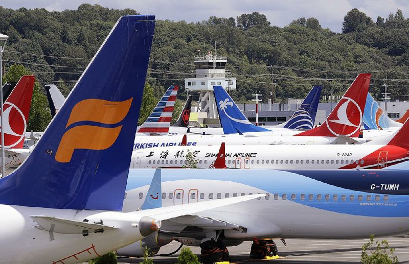 Grounded 737 Max jetliners are shown earlier this year in a parking area adjacent to Boeing Field in Seattle. 