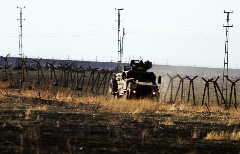 The Associated Press ARMY VEHICLES: In this photo taken from the outskirts of the village of Alakamis, in Idil province, southeastern Turkey, a Turkish army vehicles is driven in Turkey after conducting a joint patrol with Russian forces in Syria, Friday. The Britain-based Syrian Observatory for Human Rights says a protester has been killed when he was run over in the village of Sarmasakh, Syria near the border by a Turkish vehicle during a joint patrol with Russia.The man was among residents who pelted with shoes and stones Turkish and Russian troops who were conducting their third joint patrol in northeastern Syria, under a cease-fire deal brokered by Moscow that forced Kurdish fighters to withdraw from areas bordering Turkey.