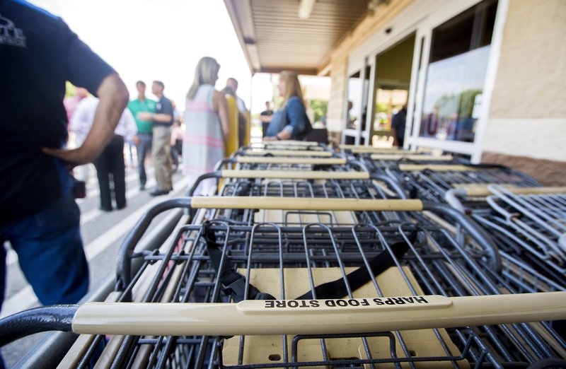 NWA Democrat-Gazette/JASON IVESTER Shopping carts sit stacked on Wednesday, Aug. 3, 2016, at the Harps Food Store in Gravette.