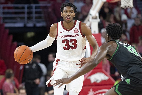 Arkansas guard Jimmy Whitt brings the ball up the floor during a game against North Texas on Tuesday, Nov. 12, 2019, in Fayetteville. 
