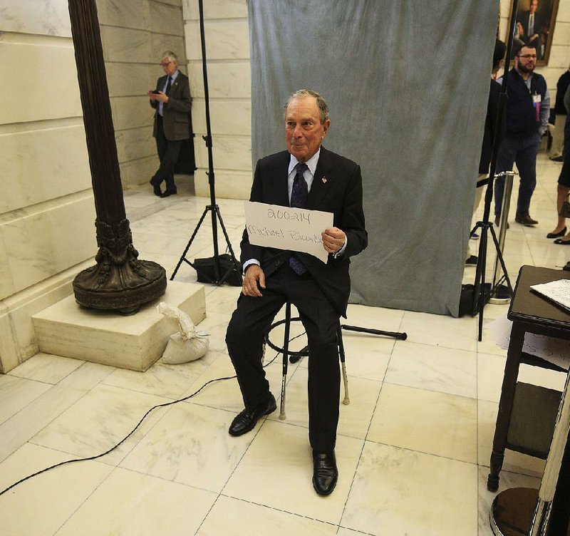 Former New York Mayor Michael Bloomberg waits Tuesday at the state Capitol to file paperwork to run as a Democrat in Arkansas’ March 3 primary. More photos at arkansasonline.com/1113bloombergfiling/ 