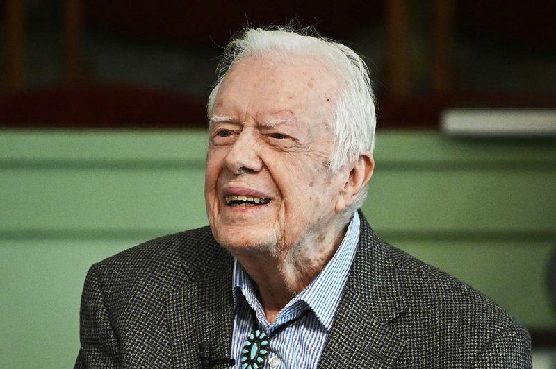 In this Sunday, Nov. 3, 2019, photo, former President Jimmy Carter teaches Sunday school at Maranatha Baptist Church in Plains, Ga. Carter has been admitted to Emory University Hospital for a procedure to relieve pressure on his brain, caused by bleeding due to his recent falls.  (AP Photo/John Amis)