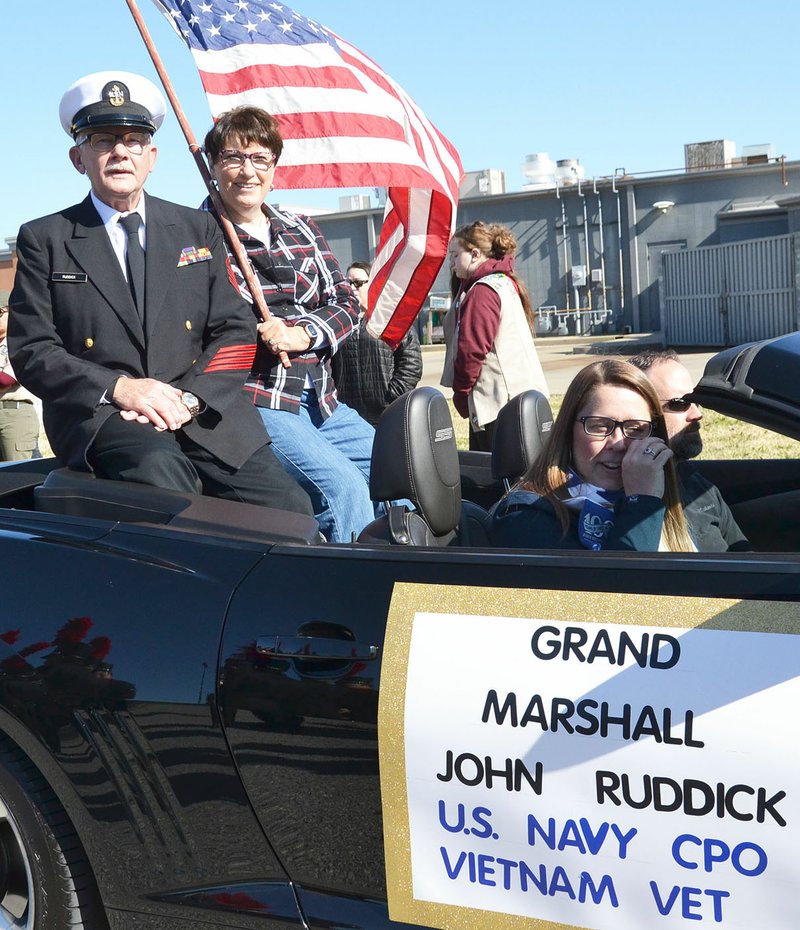 TIMES photograph by Annette Beard U.S. Navy CPO veteran John Ruddick who served during the Vietnam War was joined by wife, Sue Walker Ruddick, as grand Marshall of the Pea Ridge Veterans Parade Saturday, Nov. 9, 2019. Driving him were Josh and Kathryn Cottrell.