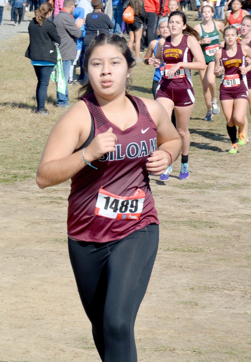 Graham Thomas/Herald-Leader Siloam Springs senior Candy Dubon ran a time of 22:17.9 on Saturday at the Class 5A state cross country meet at Oaklawn Park in Hot Springs.