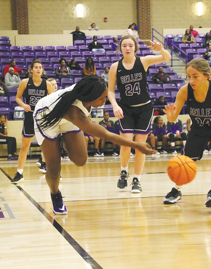 Siandhara Bonnet/News-Times Destiny Davis toes the line while attempting to pass the ball to a teammate during El Dorado's home opener against Mount St. Mary's Tuesday at Wildcat Arena. The Lady Wildcats came away with a 65-63 victory.