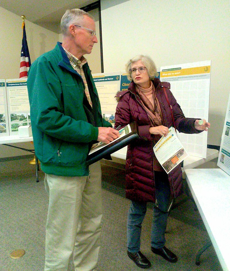 Robert Reyolds and Jean Hadley peruse informational placards that were on display during a Community Open House for a citywide historic preservation plan. The Lakota Group, an Illinois urban design firm who is drafting the plan, hosted the event Tuesday in the SouthArk Library Auditorium. The El Dorado Historic District Commission assisted with the event, which was held to solicit feedback from the community as part of the development of the preservation plan.