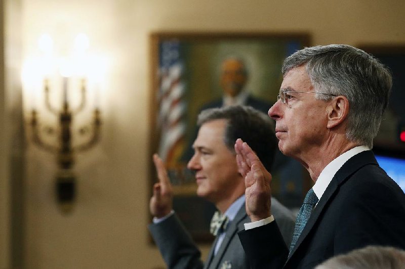 George Kent (left) and William Taylor are sworn in for Wednesday’s public hearing. Both testified that they were alarmed about U.S. dealings with Ukraine. More photos at arkansasonline.com/1114hearing/ 