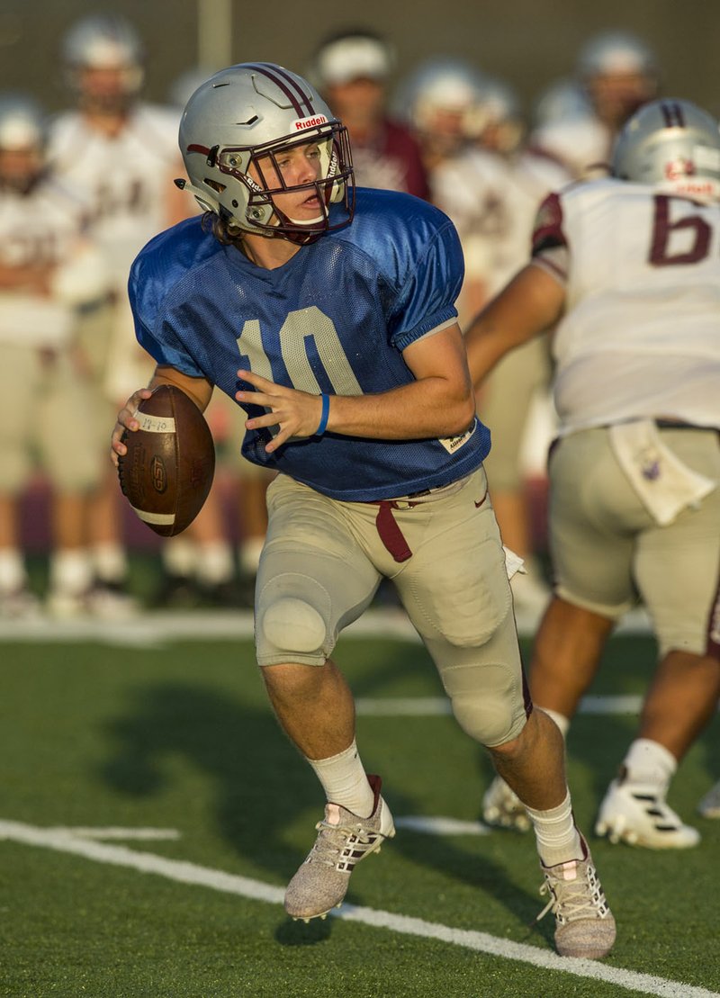 NWA Democrat-Gazette/BEN GOFF @NWABENGOFF Taylor Pool, Siloam Springs quarterback, looks for a receiver Friday, Aug. 23, 2019, during a scrimmage at Blackhawk Stadium in Pea Ridge.