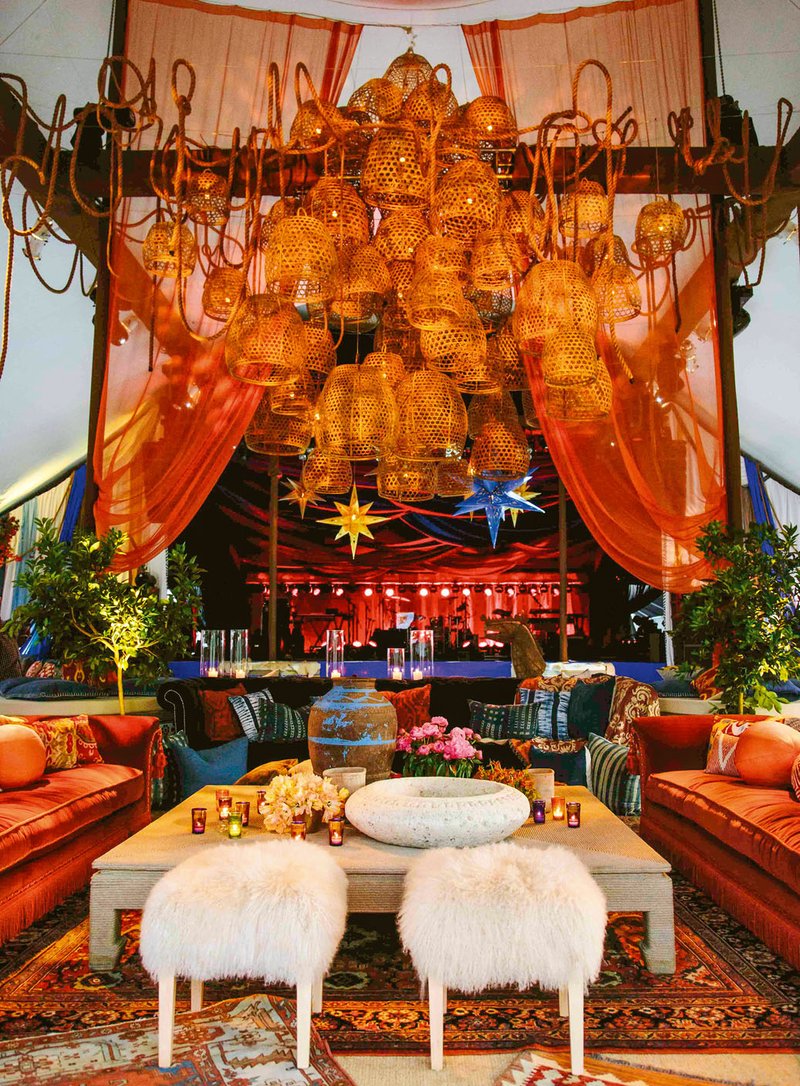 Special to the Democrat-Gazette / JOEL CALDWELL Balinese waterbaskets hanging upside down decorate a lounge area covered in oriental rugs at a 40th birthday party designed by Bronson van Wyck.