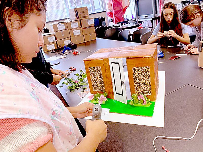 PHOTO SUBMITTED Daneida Morales, a student in the JAG program, works on a house to demonstrate teamwork and leadership skills.