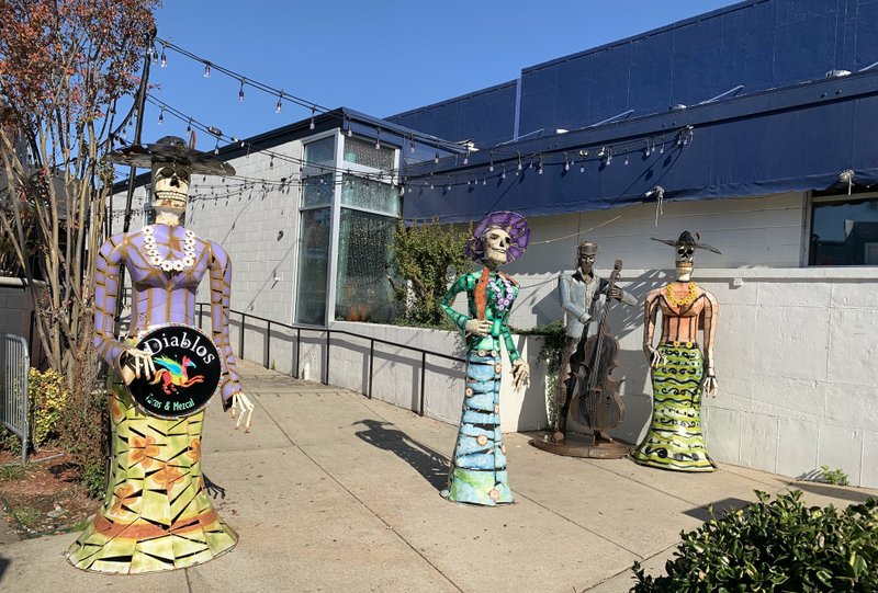Day of the Dead sculptures flank the front walk at Diablos Tacos &amp; Mezcalaria at the western edge of Little Rock's River Market District, expected to open later this month. Arkansas Democrat-Gazette/Eric E. Harrison