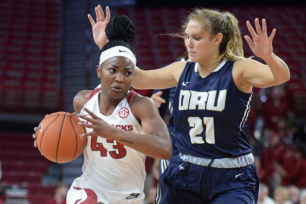 Arkansas guard Makayla Daniels (43) drives to the lane Thursday, Nov. 14, 2019, as she is pressured by Oral Roberts guard Rylie Torrey during the first half of play in Bud Walton Arena. 