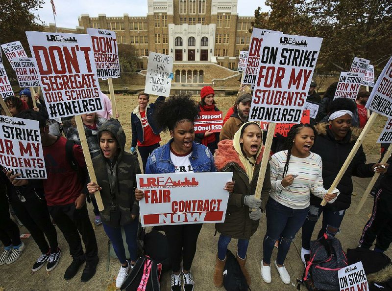 Little Rock Central High School students Arrsh Ali (from left), Taniyah Mays, Genesis Harris and Mya Conway, all 14, join the picket line Thursday outside their school. More photos at arkansasonline.com/1115lrsd/ 