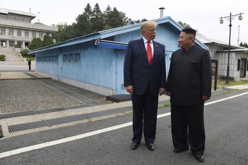 In this June 30, 2019, file photo, U.S. President Donald Trump, left, meets with North Korean leader Kim Jong Un at the border village of Panmunjom in Demilitarized Zone, South Korea. North Korea on Thursday, Nov. 14, says the United States has proposed a resumption of stalled nuclear negotiations in December as they approach an end-of-year deadline set by North Korean leader Kim Jong Un for the Trump administration to offer an acceptable deal to salvage the diplomacy. (AP Photo/Susan Walsh, File)