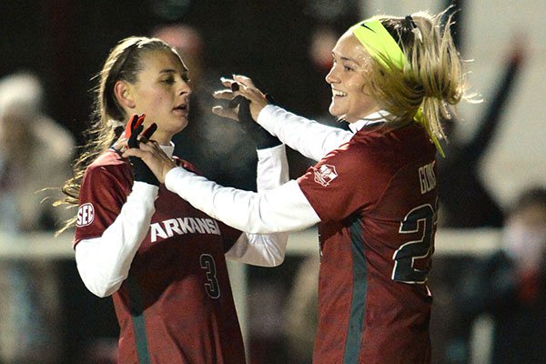 Arkansas' Parker Goins (right) and Tori Cannata celebrate after Goins scored a goal during an NCAA Tournament game against North Texas on Friday, Nov. 15, 2019, in Fayetteville.