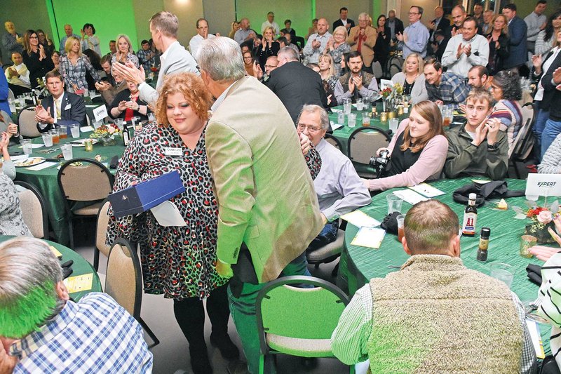 Logan Russell gets a hug from former Searcy Mayor David Morris after she received the Volunteer of the Year Award on Oct. 29 from the Searcy Regional Chamber of Commerce. The 73rd annual awards banquet was at the White County Extension Office. “I love networking with people,” Russell said.