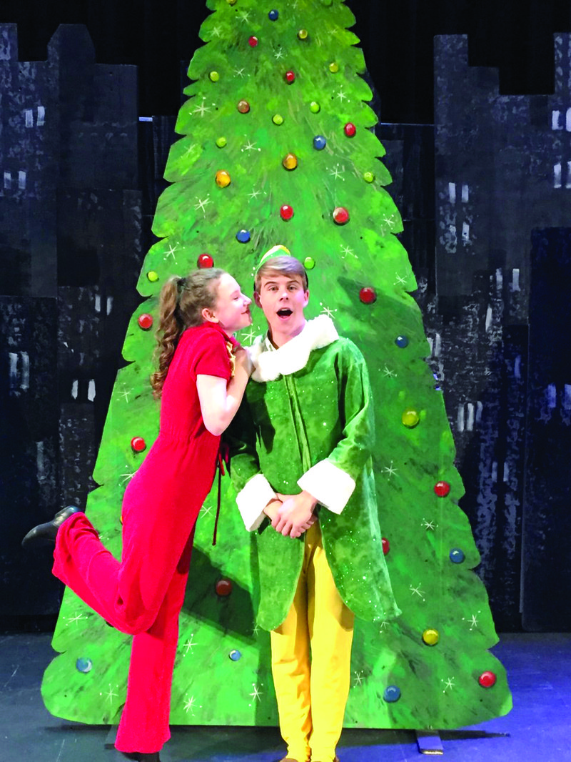 Jovie, played by Hannah Hickman, gives Buddy, played by Clay Evers, a quick kiss on the cheek in front of the Rockefeller Center Christmas Tree during “Elf the Musical Jr.” Both actors are familiar with the PCHS stage and are charter members of Thespian Troupe 8889. A performance of the musical will be held this afternoon at 2 p.m. at the Parkers Chapel School auditorium, and again tomorrow at 2 p.m.