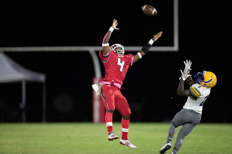 Magnolia defensive back Robert Mack goes after the ball against Hot Springs Lakeside. (Photo by Bill Nielsen)