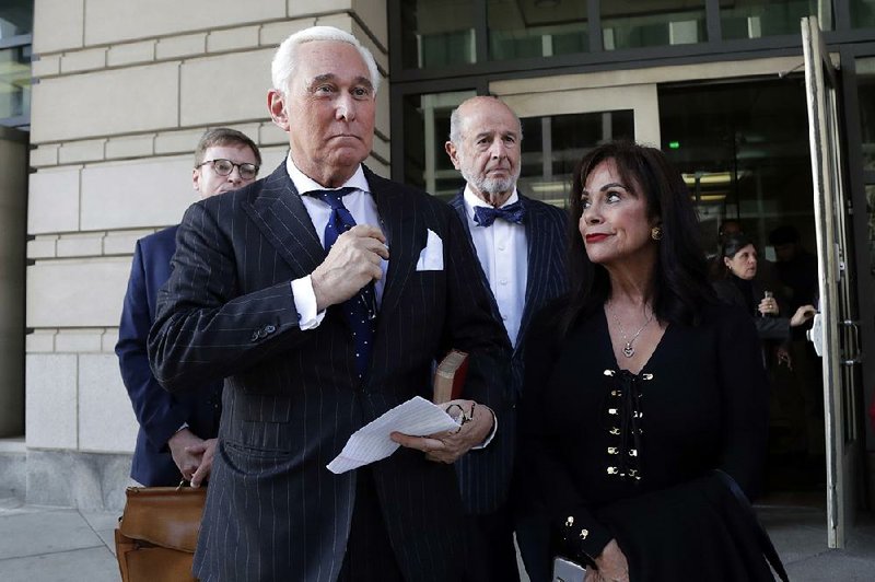 Roger Stone leaves court Friday in Washington with his wife, Nydia, after his trial. More photos at arkansasonline.com/1116trial/ 