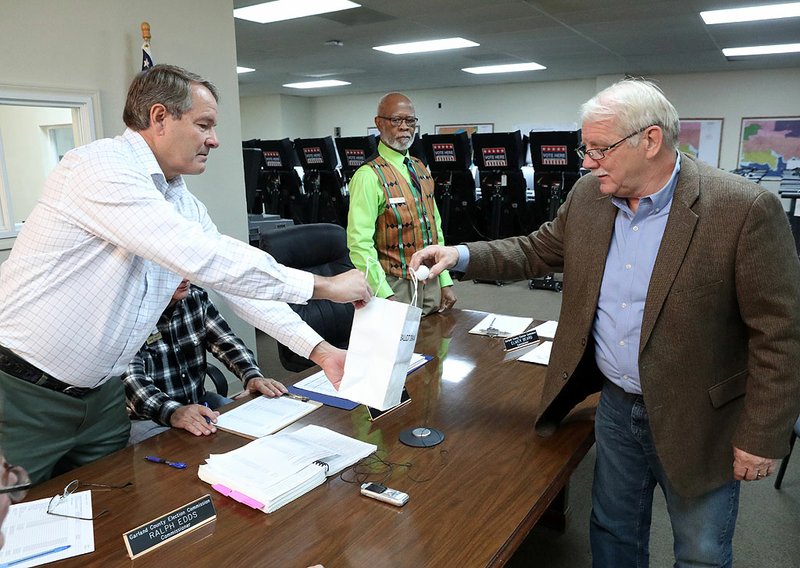 From left, Ralph Edds and Elmer Beard, members of the Garland County Election Commission, watch Friday as state representative District 22 candidate Richard McGrew draws for his ballot position at the Garland County Election Commission Building. - Photo by Richard Rasmussen of The Sentinel-Record