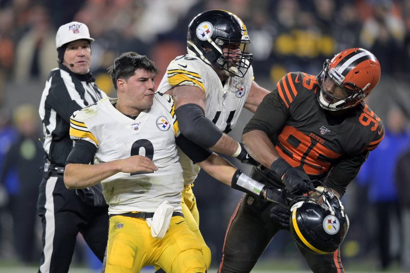 Cleveland Browns defensive end Myles Garrett (95) reacts after swinging a helmet at Pittsburgh Steelers quarterback Mason Rudolph (2) in the fourth quarter of a football game in Cleveland on Thursday. The Browns won 21-7. - Photo by The Associated Press