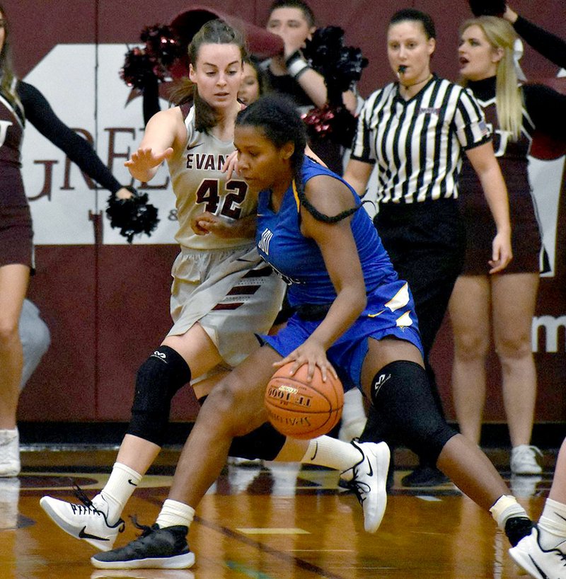 Photo courtesy of Evangel University John Brown sophomore Haley James works inside against Evangel's Anne Marie Anibal during Tuesday's game in Springfield, Mo.