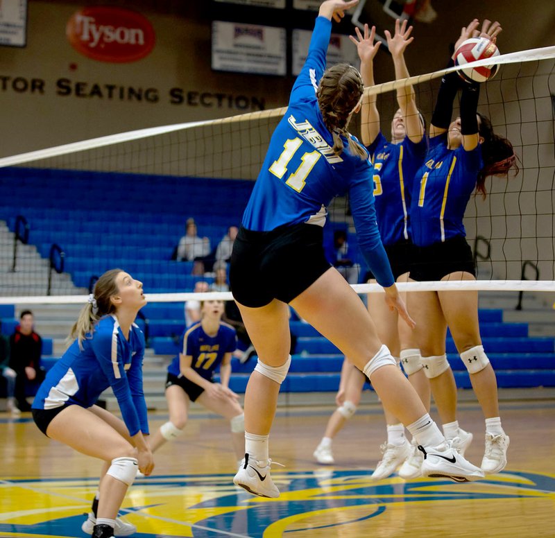 Photo courtesy of JBU Sports Information John Brown senior Megan Beck hits off the Wayland Baptist block during Tuesday's Sooner Athletic Conference quarterfinals inside Bill George Arena.