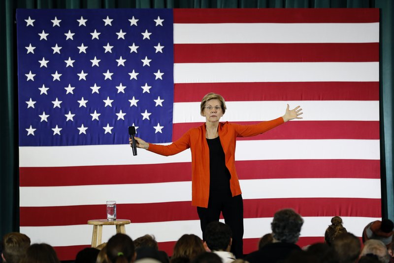 FILE - In a Monday, Nov. 4, 2019 file photo, Democratic presidential candidate Sen. Elizabeth Warren speaks during a town hall meeting at Grinnell College, in Grinnell, Iowa. Warren pushed back against critics of her newly-released plan to phase in implementation of a single-payer health care system, insisting Saturday, Nov. 16 that she is &#x201c;fully committed&#x201d; to Medicare for All and that she plans to first build on existing health care programs because &#x201c;people need help right now.&#x201d; (AP Photo/Charlie Neibergall, File)