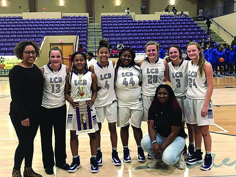 El Dorado's ninth grade girls pose with the trophy after beating Little Rock Parkview 53-51 Saturday in the finals of the Freshman Classic at Wildcat Arena.