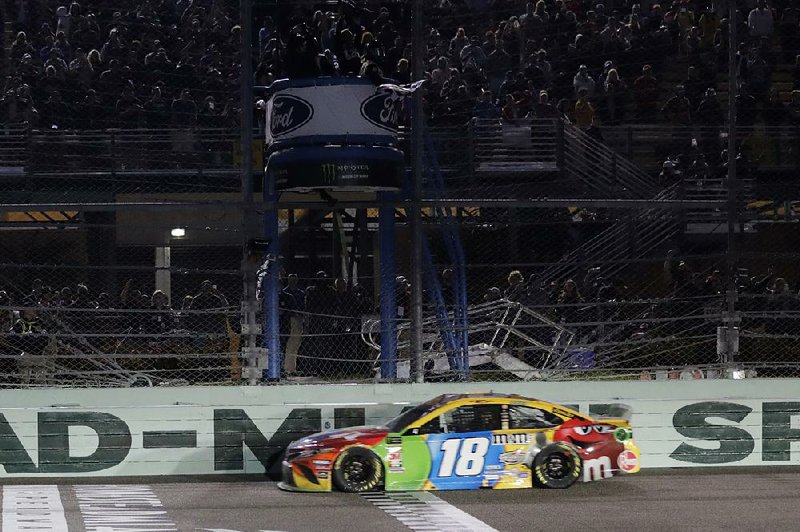 Busch crosses the finish line to win the race.