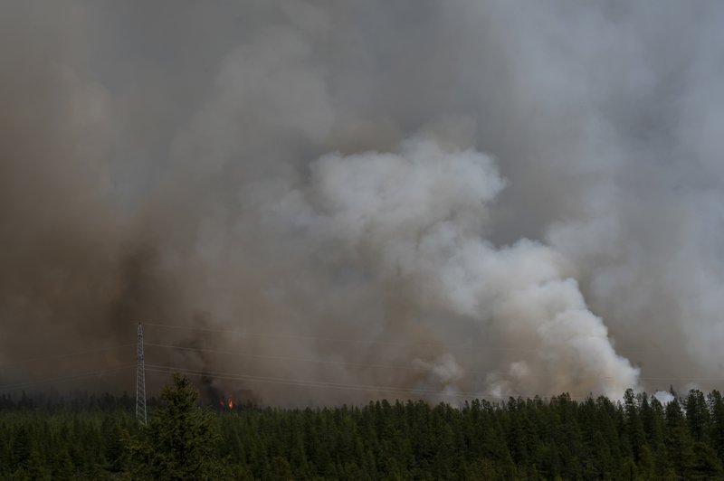 A forest fire rages outside Atka, Russia, in July. Advocacy groups say a shifting climate has already started to affect hunting, fishing and herding in indigenous areas. MUST CREDIT: Washington Post photo by Michael Robinson Chavez