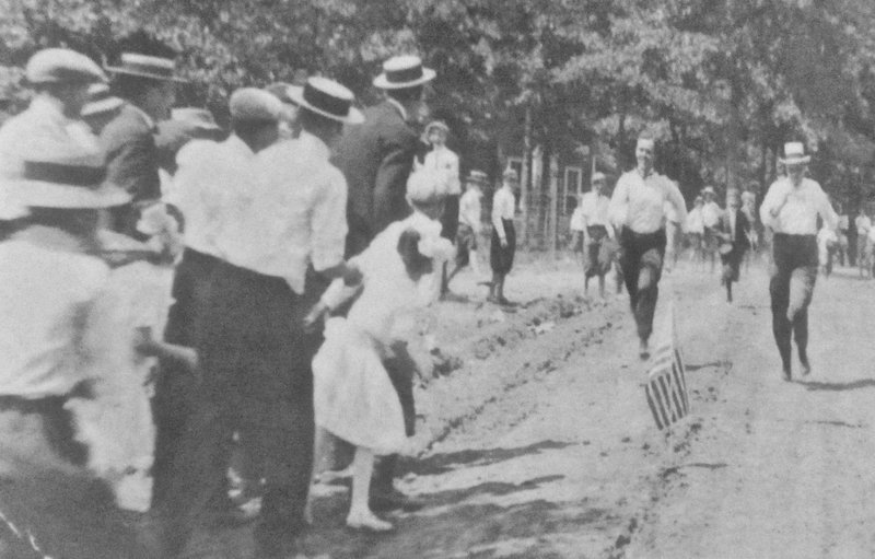 At Grant County Museum, a photo taken from a long-ago postcard shows competitors in a Fat Man's Race. (Photo by Marcia Schnedler, special to the Democrat-Gazette)