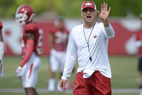 Arkansas assistant coach Barry Lunney Jr. directs his players Thursday, Aug. 9, 2018, during practice at the university's practice facility in Fayetteville. 