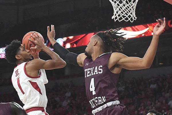 Arkansas' Isaiah Joe goes up for a shot as Texas Southern's Bryson Etienne defends during a game Tuesday, Nov. 19, 2019, in Fayetteville. 
