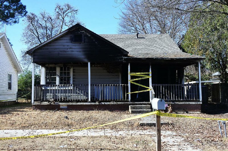 The damaged home is seen in the 800 block of North 35th Street after Tuesday’s fire in Fort Smith. 