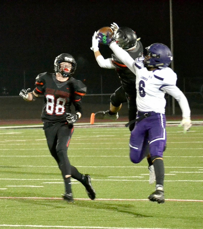 TIMES photograph by Annette Beard
Early in the third quarter, Friday, Nov. 15, Lonoke's quarterback attempted to throw a wheel route. Blackhawk senior, defensive back/wide receiver, Hunter Rains (No. 11)intercepted the ball and ran it back for a 52-yard touchdown, allowing the Blackhawks to regain the momentum of the game, according to coach Stephen Neal.
  