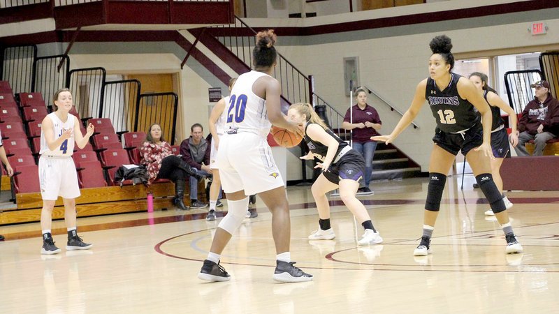 Photo submitted John Brown sophomore Haley James looks for a pass Saturday against Bellevue (Neb.) during the College of the Ozarks Classic in Point Lookout (Mo.).