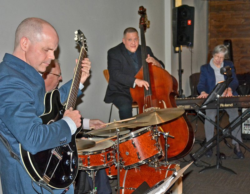 Janelle Jessen/Herald-Leader Guitarist Ben Harris (left), drummer Steve Wilkes, bassist Kyth Trantham and pianist Claudia Burson perform during Siloam Springs Center for the Arts' Jazz at the Springs on Saturday evening.