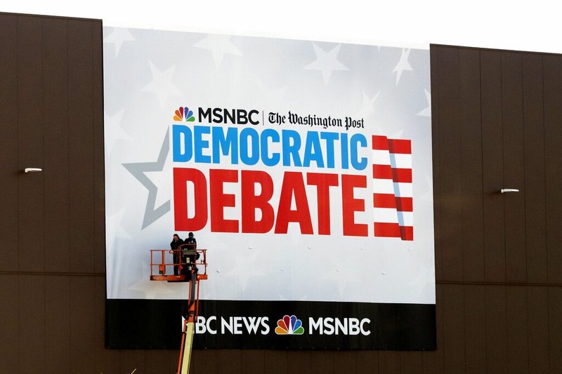 In this Tuesday, Nov. 19, 2019 photo, preparations for the Democratic presidential primary debate are underway before Wednesday's debate in Atlanta. (AP Photo/John Amis)