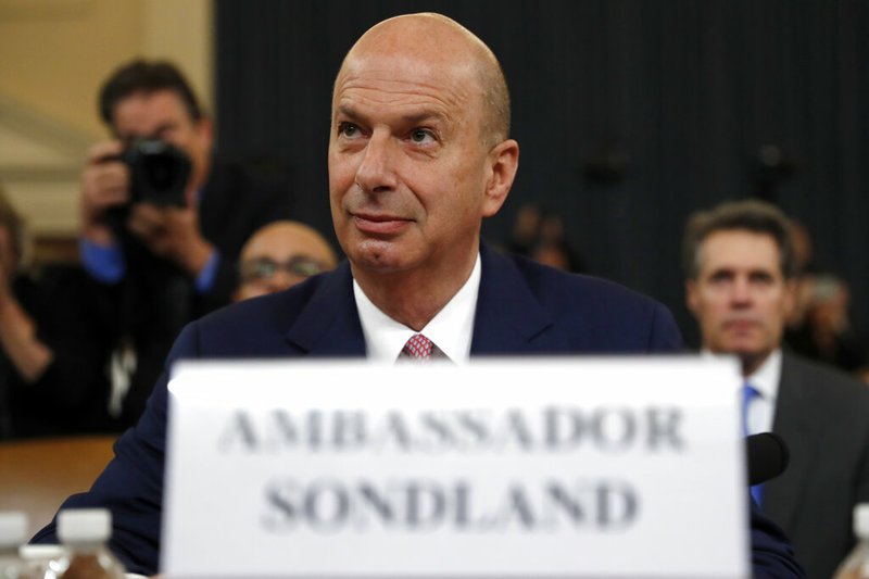 U.S. Ambassador to the European Union Gordon Sondland arrives to testify before the House Intelligence Committee on Capitol Hill in Washington, Wednesday, Nov. 20, 2019, during a public impeachment hearing of President Donald Trump's efforts to tie U.S. aid for Ukraine to investigations of his political opponents.