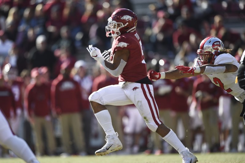 Arkansas running back Rakeem Boyd (5) carries the ball for an 86-yard touchdown drive, Saturday, November 9, 2019 during the fourth quarter of a football game at Donald W. Reynolds Razorback Stadium in Fayetteville.