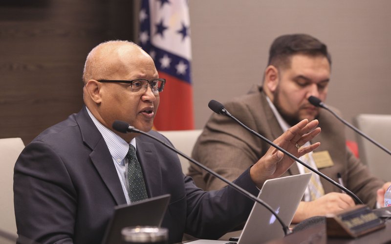 In this 2018 file photo Arkansas Charter Authorizing Panel member Naccaman Williams (left) asks a question during a Little Rock meeting. 
(Democrat-Gazette file photo)