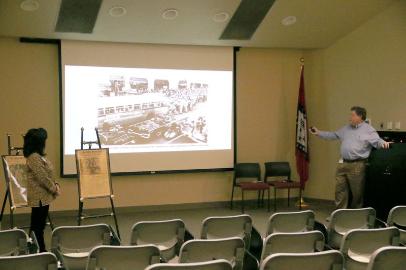 South Arkansas Community College foundation director Cynthia Reyna and bookstore manager Mark Smith discuss their memories from President John F. Kennedy's assassination Nov. 20, 2019.