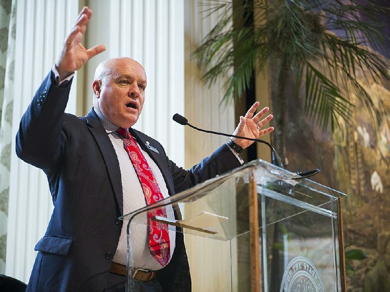 FILE - Little Rock School District Superintendent Mike Poore speaks to a gathering of the Political Animals Club at the Governor’s Mansion in 2019. 