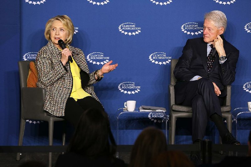 FILE — Former Secretary of State Hillary Rodham Clinton speaks in this Wednesday, Nov. 20, 2019 file photo, as she and her husband, former President Bill Clinton, participate in a panel discussion at the Economic Inclusion and Growth: The Way Forward conference in Little Rock. 